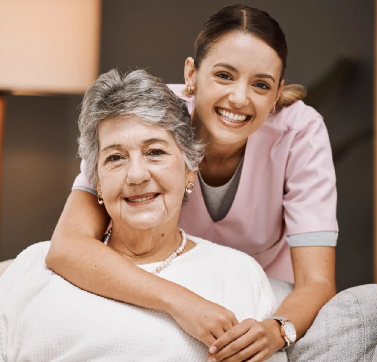 Senior woman smiling with caregiver in Southern California